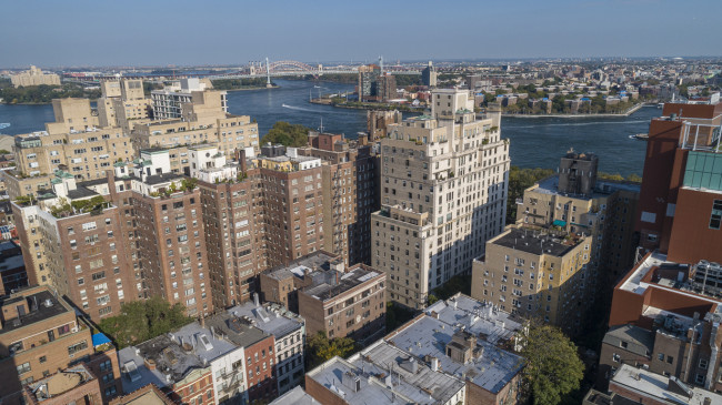 Aerial panoramic scenic view over Upper East Side Manhattan and East River toward Astoria, Queens, New York, USA