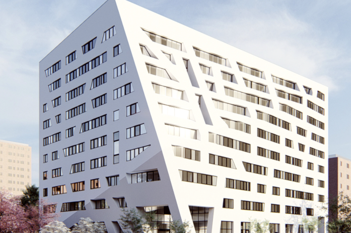 White exterior of modern housing complex at 57 Marcus Garvey Blvd, Brooklyn, 