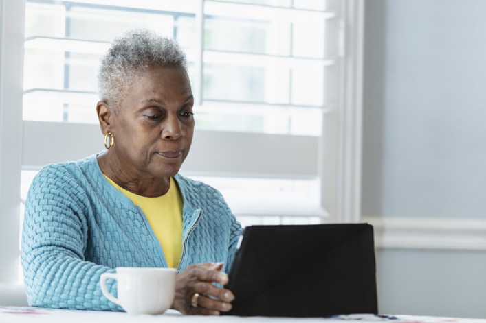 Black woman using digital tablet