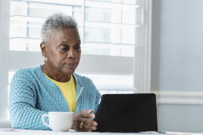 Black woman using digital tablet