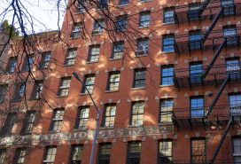 Greenwich Village, Manhattan, New York, USA -March, 2024. New York Warehouse apartment block. Classic exterior metal fire escapes on or near Greenwich Street in New York City.