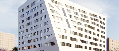 White exterior of modern housing complex at 57 Marcus Garvey Blvd, Brooklyn,