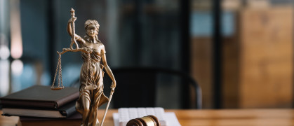 Statue of lady justice on desk of a judge or lawyer. stock photo