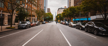 Manhattan street view with parked cars and apartment buildings