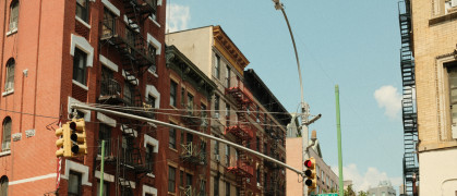 Red brick buildings with fire escapes in NYC